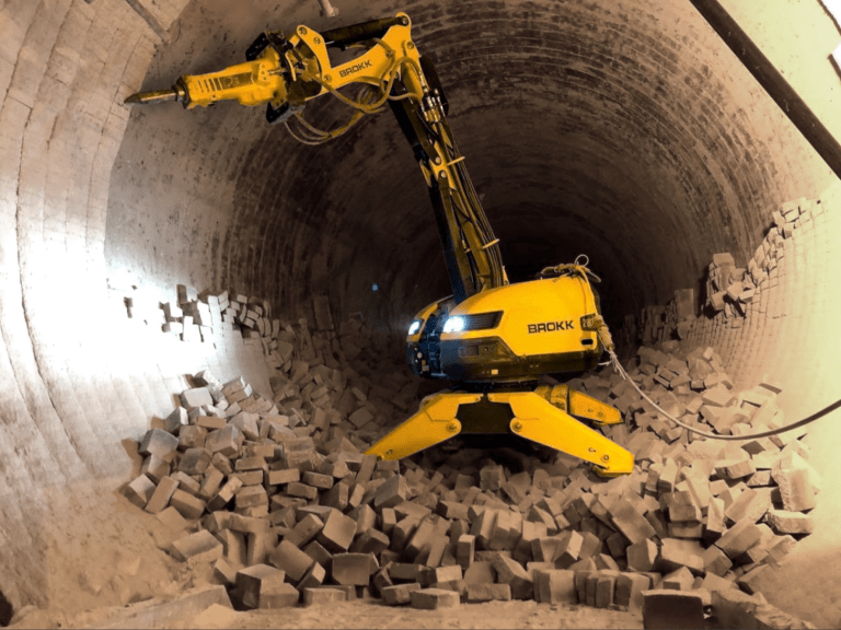 Brokk demolition robot performing controlled concrete removal inside tunnel for high-risk and confined construction environments