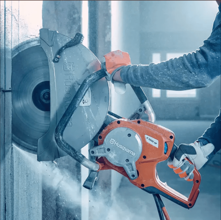 Husqvarna concrete cutting saw delivering precise slab sawing with smooth cuts and reduced vibration on commercial construction site