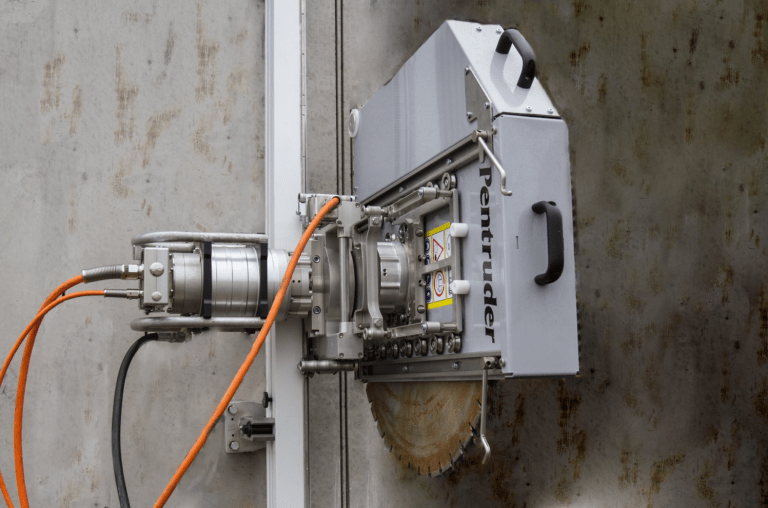 Pentruder wall saw cutting reinforced concrete wall with high-frequency precision for renovation and structural modification projects